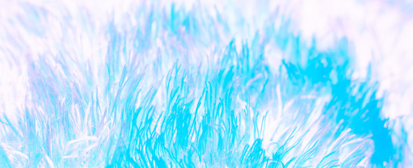 Texture of fluffy blue neon fabric in neon pastel colors. macro