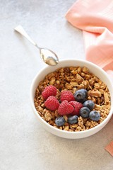 Granola with fresh berries. Healthy gluten free vegetarian breakfast
