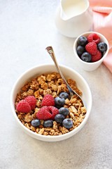 Granola with fresh berries. Healthy gluten free vegetarian breakfast