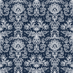 Seamless dark blue lace background with white floral pattern