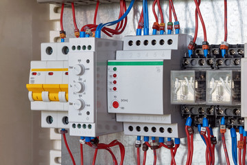 Modular three-phase circuit breaker, phase control relay with adjustments, level control relay, two intermediate relays in electrical Cabinet. Electrical wires are connected according to the diagram.