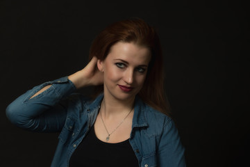 Studio low key portrait of beautiful  woman