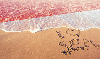 Beach sand, sea and flag Indonesia. I love Indonesia concept
