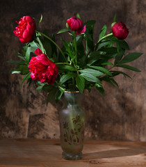 Artistic still life with peonies in vase