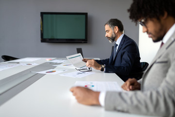 Businesspeople discussing together in conference room during meeting at office