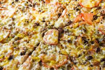 Obraz na płótnie Canvas The surface texture of the pizza. Close up.