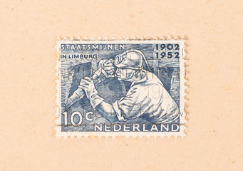 THE NETHERLANDS 1950: A stamp printed in the Netherlands shows the mining of coal, circa 1950