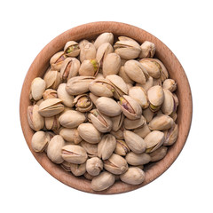 Plate with salted pistachios isolated on white background