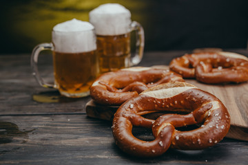 pretzels and beer on wooden table