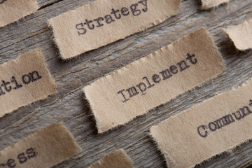 Implement - word on a piece of paper close up, business creative motivation concept