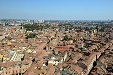 Fototapeta na wymiar Aerial panoramic cityscape of Bologna, Italy, above rooftops of typical houses, ancient buildings and medieval towers