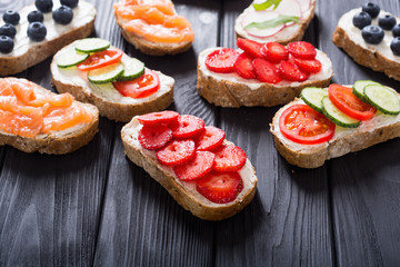 Variation of toast with fruit , vegetable and salmon