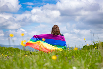 Young woman with LGBT flag.