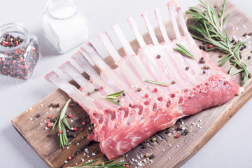 Raw rack of lamb with spices and herbs