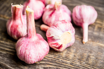 Garlic cloves on the rustic background. Selective focus. Shallow depth of field.