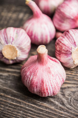 Garlic cloves on the rustic background. Selective focus. Shallow depth of field.