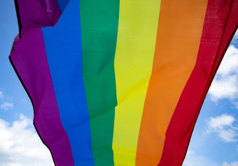 Colorful LGBT flag blows in the breez.