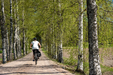 Woman bicycling on the road