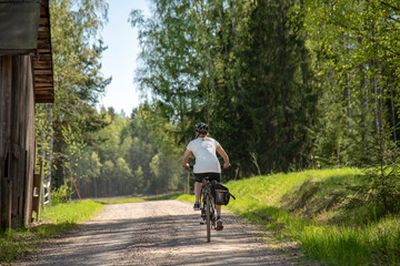 Obraz premium Woman bicycling on the road