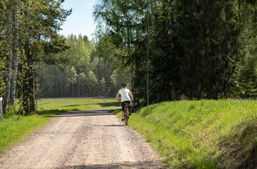 Woman bicycling on the road