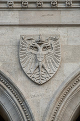 Heraldic Coat of Arms as decoration elements at facade of main city hall (Rathaus) in Vienna, Austria
