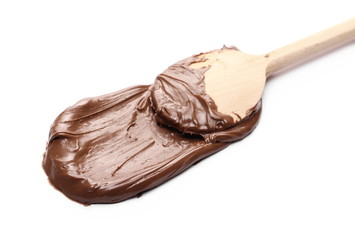 Cream chocolate spread with wooden spoon isolated on white background