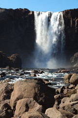 Famous Iceland waterfalls with a clean water on a stony rocky mountain landscape