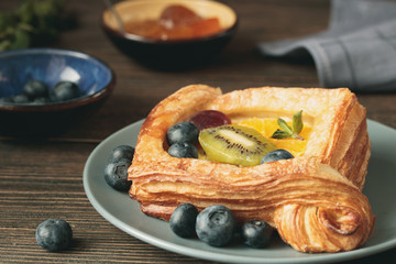 open fruit cake puff pastry with peach and blueberry