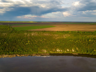 Fototapeta premium Flight over the river and forest at spring time. Dniester river of Moldova republic.