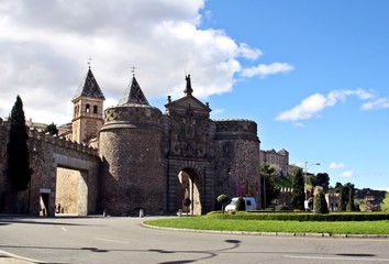 Fototapeta na wymiar Hinge door. It's a gate of the medieval Wall of Toledo in Spain.