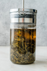 Green Tea with French Press in Daylight