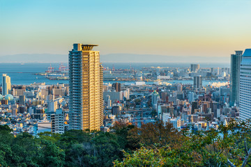 Fototapeta na wymiar beautiful panoramic aerial view of sunset Kobe city with modern buildings and coastline, Japan