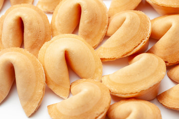 Chinese fortune cookies. Cookies pile with blank blank inside for words prediction. Isolated on white background.