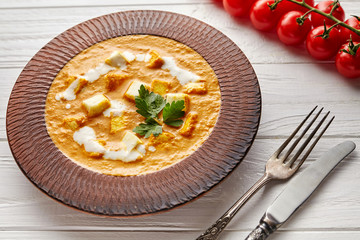 Shahi paneer Indian vegetarian masala asian meal with vegetables, white sauce and butter paneer cottage cheese spicy food vegan north India dish served with cherry tomatoes on white background