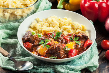Hungarian beef goulash serwed with galuska noodles