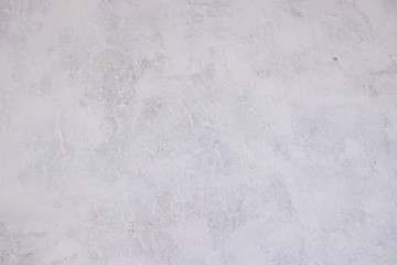 Texture concrete wall with putty. A thin layer of putty. White putty on a gray wall.