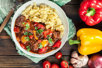 Hungarian beef goulash serwed with galuska noodles