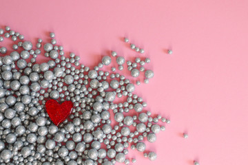 Balls shiny wall background texture, brooch heart. Pink backgrownd