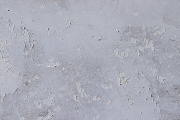 Texture concrete wall with putty. A thin layer of putty. White putty on a gray wall.