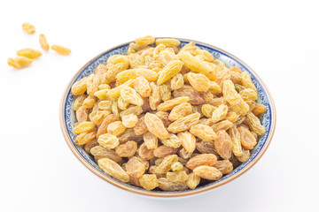 Dried grapes or raisins on white background