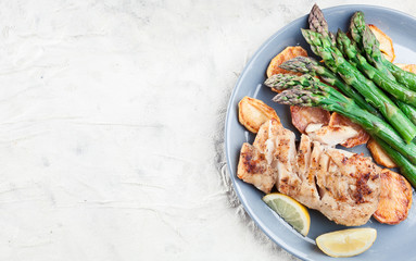 Fried cod fillet with green asparagus
