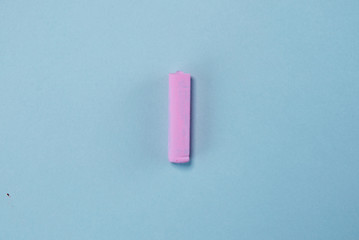 Pink flash lie on pastel blue background. Minimal summer concept.