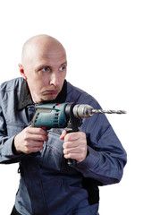 A man in working clothes, with an electric drill in his hands. Portrait of a middle-aged man, European appearance, in a working overalls, with an electric drill. Isolated on white background