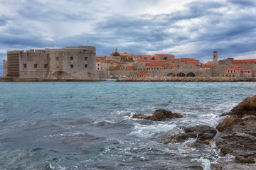 Dubrovnik, a landscape overlooking the old town and large stones in the foreground, Croatia