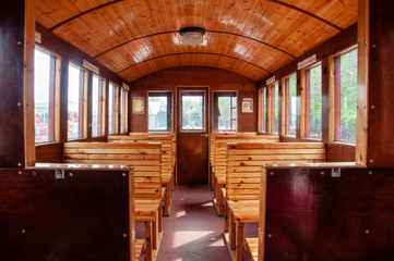 Vintage Train Salon Inside. Old wooden benches in the train in the interior.