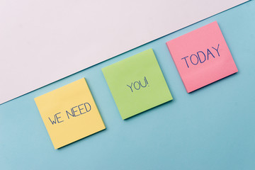 Text sign showing We Need You. Business photo showcasing asking someone to work together for certain job or target Pastel colour note papers placed sideways on the of softhued backdrop