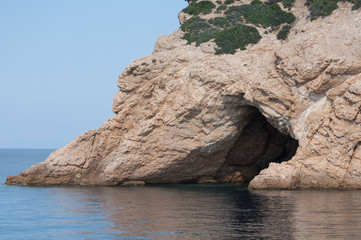 Fototapeta premium cave carved by water, seen from the boat