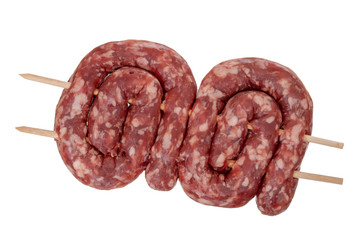 Raw meat, sausages for barbecue on wooden skewers. Isolated on white.
