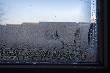 Condensation formed on window glass on winter morning  1
