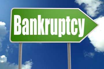 Bankruptcy word with green road sign